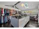 Spacious walk-in closet with custom shelving and a central island for organization at 2121 Valencia Ter, Charlotte, NC 28226