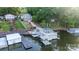 Stunning aerial view of the lakefront homes, steps to the water, and boat dock at 24264 Strand Dr, Albemarle, NC 28001
