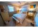 Comfortable bedroom featuring a cozy bed, neutral walls, and natural lighting at 24264 Strand Dr, Albemarle, NC 28001