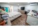 Functional bedroom with wood floors, neutral colors, and good natural light at 24264 Strand Dr, Albemarle, NC 28001
