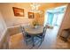 Charming dining room with a round table, surrounded by beach-themed decor and plenty of natural light at 24264 Strand Dr, Albemarle, NC 28001
