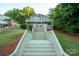 Charming lake house with multiple decks and steps leading to the lake. Waterfront living at its finest! at 24264 Strand Dr, Albemarle, NC 28001