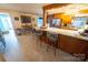 Open kitchen featuring a breakfast bar with wooden cabinets, seating, and stainless steel appliances at 24264 Strand Dr, Albemarle, NC 28001