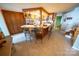 Open kitchen with breakfast bar, dark wood cabinets, and stainless steel appliances at 24264 Strand Dr, Albemarle, NC 28001
