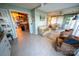 Spacious living room with tile flooring, open to kitchen, and plenty of seating at 24264 Strand Dr, Albemarle, NC 28001