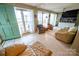 Inviting living room with lake views, comfortable seating, and lots of natural light at 24264 Strand Dr, Albemarle, NC 28001
