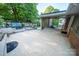 Outdoor patio and lounge area with lake views and a serene setting for relaxing or entertaining at 24264 Strand Dr, Albemarle, NC 28001