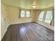 Bedroom with laminate floors, light walls and multiple windows at 2482 E Nc 10 Hwy, Conover, NC 28613