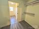 Walk in closet featuring neutral walls, contrasting trim, and wood-look flooring at 2482 E Nc 10 Hwy, Conover, NC 28613