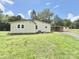 Rear view of the house showcasing a well-kept lawn and detached structure at 2482 E Nc 10 Hwy, Conover, NC 28613