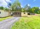 House with a carport and storage shed, set in a spacious, grassy area at 2482 E Nc 10 Hwy, Conover, NC 28613