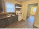 Kitchen featuring updated cabinets, stainless sink, and updated flooring at 2482 E Nc 10 Hwy, Conover, NC 28613