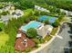 Aerial view of neighborhood amenities, including a large pool, tennis courts, and playground at 2802 Azalea Hills Dr, Charlotte, NC 28262