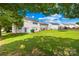 Spacious backyard featuring a well-maintained lawn and ample space for outdoor activities at 2802 Azalea Hills Dr, Charlotte, NC 28262