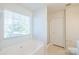 Bathroom showcasing a soaking tub with jets, a separate shower, and a window for natural light at 2802 Azalea Hills Dr, Charlotte, NC 28262