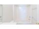 Bathroom featuring a tub and shower combo with white tile surround and modern fixtures at 2802 Azalea Hills Dr, Charlotte, NC 28262