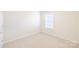 Cozy bedroom featuring neutral carpet and a window, creating a peaceful retreat at 2802 Azalea Hills Dr, Charlotte, NC 28262