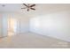 Neutral bedroom showcasing doors leading to the ensuite bathroom and ample space for furnishings at 2802 Azalea Hills Dr, Charlotte, NC 28262