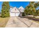 Charming two-story home with a well-maintained front yard and a two-car garage at 2802 Azalea Hills Dr, Charlotte, NC 28262