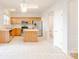 Well-lit kitchen featuring stainless steel appliances, wood cabinets, an island and tile flooring at 2802 Azalea Hills Dr, Charlotte, NC 28262