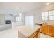 Open kitchen with island featuring stainless steel appliances, wood cabinetry, and natural light at 2802 Azalea Hills Dr, Charlotte, NC 28262