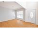 Spacious living room with wood floors, natural light, and a modern chandelier at 2802 Azalea Hills Dr, Charlotte, NC 28262