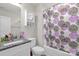 Cozy bathroom with a shower-tub combo and granite countertop vanity at 2908 Burgess Dr, Charlotte, NC 28208