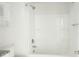 The bathroom is crisp and clean with a bath and overhead shower at 2908 Burgess Dr, Charlotte, NC 28208