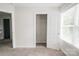 Bright bedroom featuring neutral walls, carpet, and a closet space for easy organization at 2908 Burgess Dr, Charlotte, NC 28208