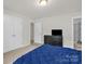 Bedroom features a dresser and large closet providing ample storage space at 2908 Burgess Dr, Charlotte, NC 28208