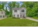 Charming two-story home with a well-manicured lawn and fresh landscaping at 2908 Burgess Dr, Charlotte, NC 28208