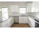 Bright kitchen with white cabinetry, stainless steel appliances, subway tile backsplash and granite counters at 2908 Burgess Dr, Charlotte, NC 28208