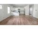 Bright, open-concept kitchen featuring white cabinetry, stainless steel appliances, and a large island at 2908 Burgess Dr, Charlotte, NC 28208