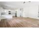 Bright, open kitchen featuring stainless steel appliances, white cabinets, and an eat-in breakfast bar at 2908 Burgess Dr, Charlotte, NC 28208