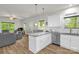 Kitchen island with granite countertops provides additional workspace and seating at 2908 Burgess Dr, Charlotte, NC 28208