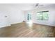 Bright living room with hard surface floors and sliding glass doors to outdoor space at 2908 Burgess Dr, Charlotte, NC 28208