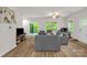 Comfortable living room with wood floors, natural light, and easy access to the outdoors at 2908 Burgess Dr, Charlotte, NC 28208