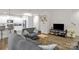 Open-concept living room with seamless flow to the kitchen, ideal for entertaining at 2908 Burgess Dr, Charlotte, NC 28208
