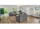 Bright living room with wood floors, natural light, and comfortable seating arrangement at 2908 Burgess Dr, Charlotte, NC 28208