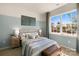 Comfortable bedroom with a baseball theme, a large window, and soft lighting for a peaceful retreat at 3019 Sassafras Trl, Gastonia, NC 28056