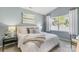 Bright, neutral-toned bedroom with a window, soft bedding, and ample natural light at 3019 Sassafras Trl, Gastonia, NC 28056