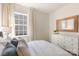 Bedroom featuring a large window, hardwood style flooring, large mirror and ample natural light at 3019 Sassafras Trl, Gastonia, NC 28056
