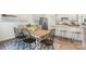 Bright dining area boasts modern chairs and a stylish table next to the kitchen with counter seating at 3019 Sassafras Trl, Gastonia, NC 28056