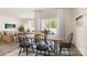 Bright dining room with large table, cozy seating, and natural light from sliding glass doors at 3019 Sassafras Trl, Gastonia, NC 28056
