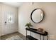 Inviting entryway with stylish decor, a decorative mirror, and hardwood floors, creating a warm welcome at 3019 Sassafras Trl, Gastonia, NC 28056