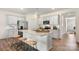 Modern kitchen with granite countertops, stainless steel appliances, a center island, and ample cabinet space at 3019 Sassafras Trl, Gastonia, NC 28056