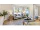 Bright living room featuring a comfortable sofa, stylish decor, and natural light, creating a welcoming space at 3019 Sassafras Trl, Gastonia, NC 28056