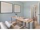 Bright home office featuring an open doorway, modern desk, and neutral-toned decor at 3019 Sassafras Trl, Gastonia, NC 28056