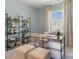 Bright office space with a window, decorative shelving, stylish furniture, and neutral color scheme at 3019 Sassafras Trl, Gastonia, NC 28056