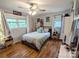 Cozy bedroom with hardwood floors, a ceiling fan, and natural light from the windows at 3116 Pilgrim Rd, Chester, SC 29706